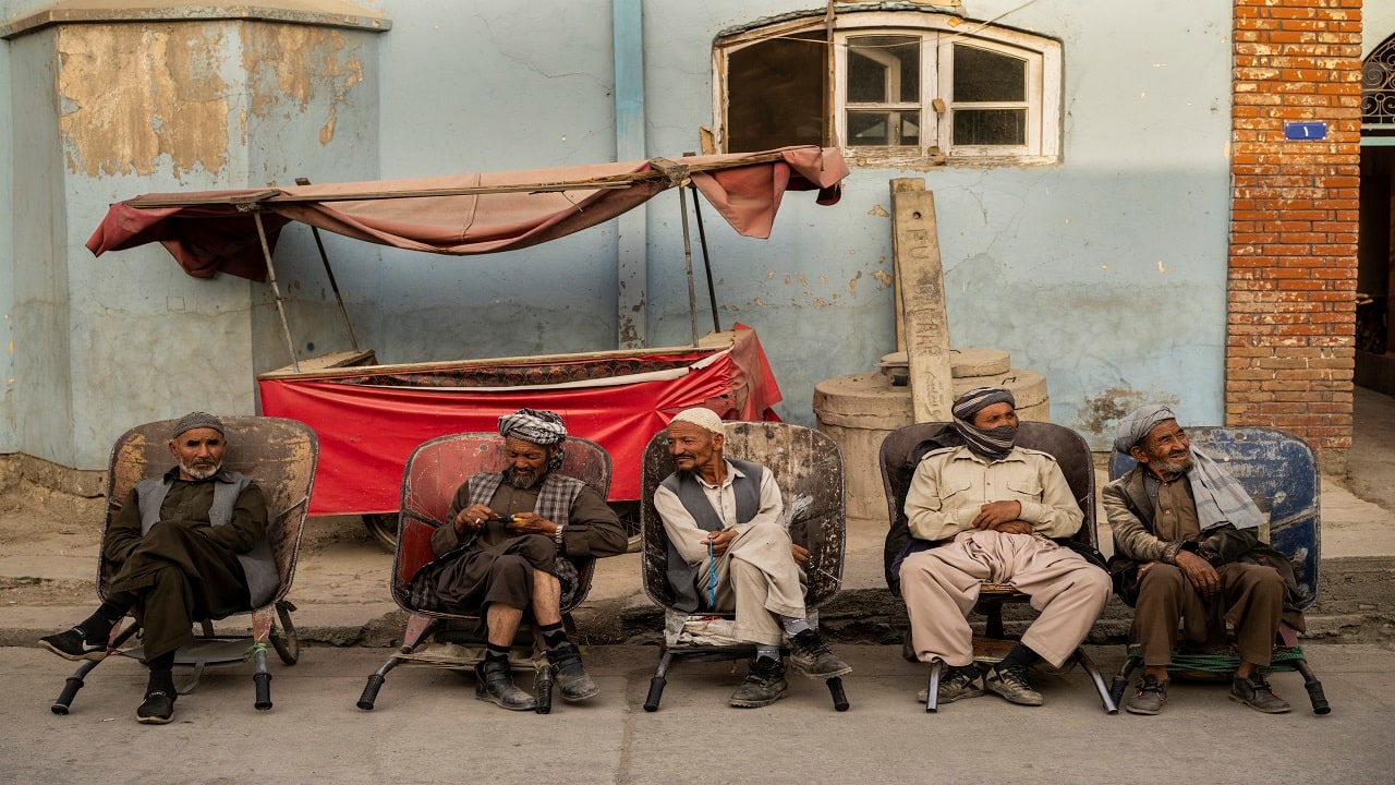Laborers wait in the street to be hired in Kabul, Afghanistan. (AP Photo/Bernat Armangue)