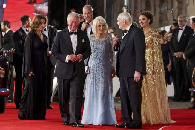 Barbara Broccoli, left and producer Michael G. Wilson, centre right, walk with Britain's Kate, the Duchess of Cambridge, right, Prince William, background, Camilla, the Duchess of Cornwall, centre and Prince Charles, centre left as they arrive for the World premiere of the new film from the James Bond franchise 'No Time To Die', in London, Tuesday, Sept. 28, 2021. (Chris Jackson/Pool Photo via AP)