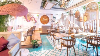 With sculptural light fixtures, playful swings and a ceiling dotted with herb planters, Blah! is a fun place to see and be seen in. The ceiling to floor glass windows ensure ample sunlight streams in throughout the day.