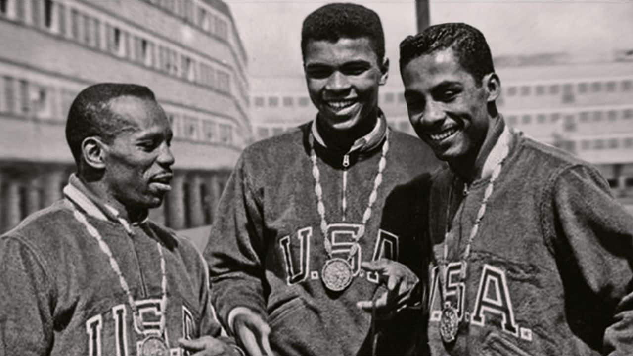 Muhammad Ali (centre) after winning Olympic Gold at Rome, in a still from 'Blood Brothers: Malcolm X & Muhammad Ali' (Image: Netflix)