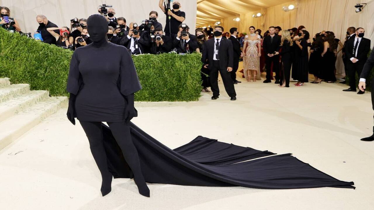 American fashion icon Kim Kardashian stood apart and aced her red-carpet look in an unusual black Balenciaga Haute Couture bodysuit, which covered her face as well. 