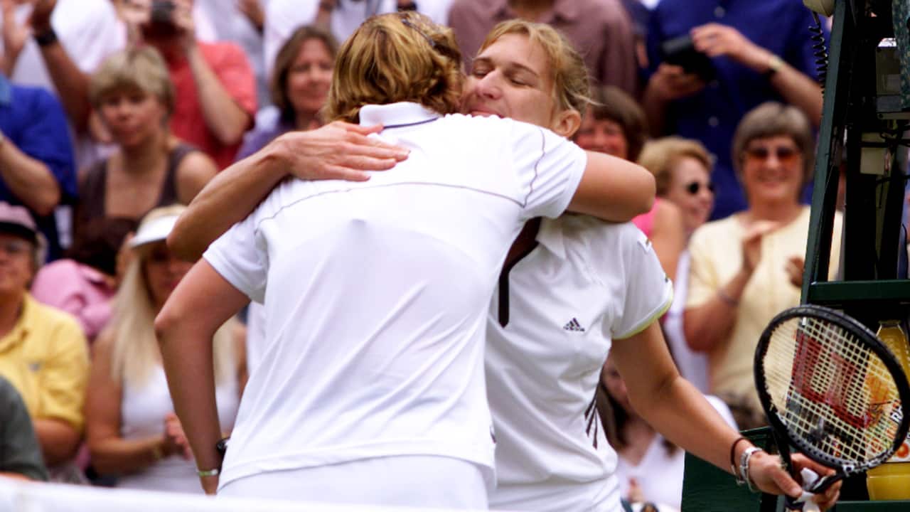 Lindsay Davenport of the U.S. (L) and Germany's Steffi Graf embrace at the end of the women's Singles competition at the Wimbledon Tennis Championships July 4. Davenport won the match 6-4 7-5. (PC-Reuters/Kieran Doherty)