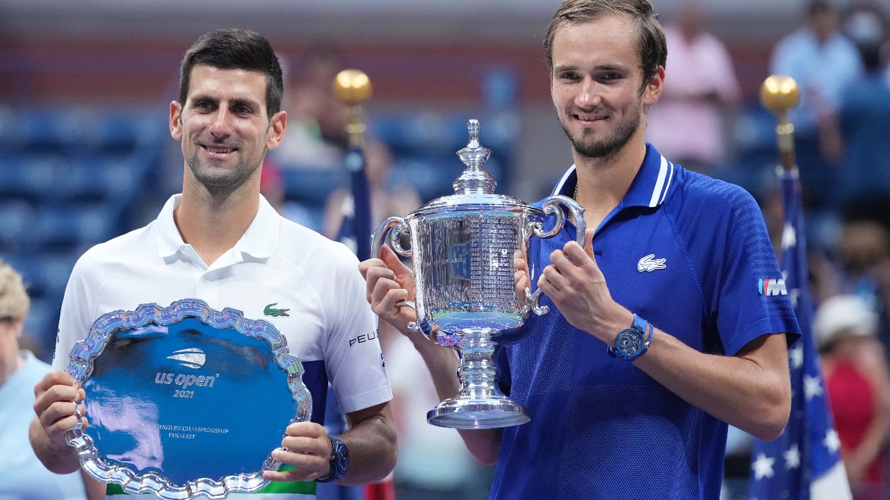 (L-R) Novak Djokovic of Serbia and Daniil Medvedev of Russia celebrate with the finalist and championship trophies, respectively, after their match in the men's singles final on day fourteen of the 2021 U.S. Open tennis tournament at USTA Billie Jean King National Tennis Center. (Mandatory Credit: Danielle Parhizkaran-USA TODAY Sports)