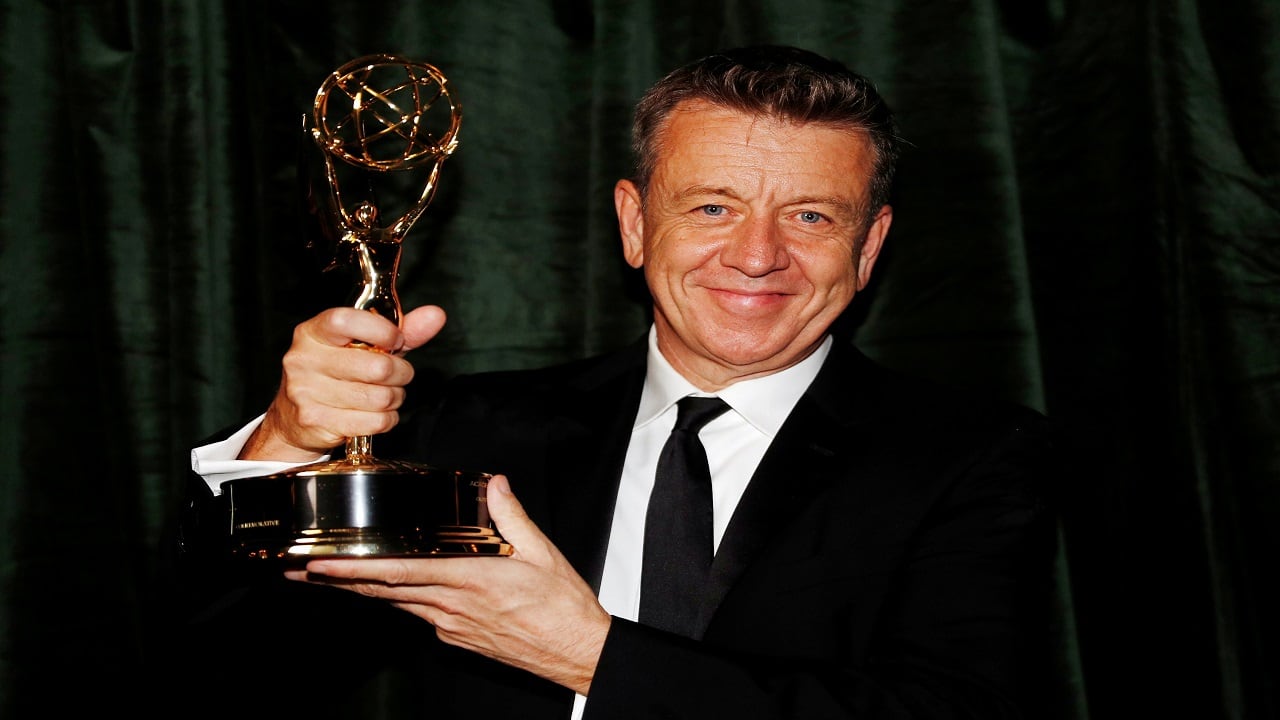 Peter Morgan poses with his Emmy award for Outstanding Writing for a Drama Series, backstage at the Netflix UK Primetime Emmy for "The Crown", in London, Britain, September 20, 2021. REUTERS/Peter Nicholls REFILE - CORRECTING DATE - RC2DTP9QLE95 Peter Morgan poses with his Emmy award for Outstanding Writing for a Drama Series, backstage at the Netflix UK Primetime Emmy for "The Crown", in London, Britain, September 20, 2021. REUTERS/Peter Nicholls REFILE - CORRECTING DATE - RC2DTP9QLE95