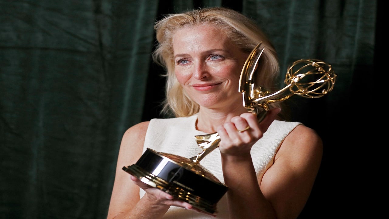 Gillian Anderson poses with her Emmy award for Outstanding Supporting Actress in a Drama Series, backstage at the Netflix UK Primetime Emmy for "The Crown", in London, Britain, September 20, 2021. REUTERS/Peter Nicholls - RC2ETP97HPPF Gillian Anderson poses with her Emmy award for Outstanding Supporting Actress in a Drama Series, backstage at the Netflix UK Primetime Emmy for "The Crown", in London, Britain, September 20, 2021. REUTERS/Peter Nicholls - RC2ETP97HPPF