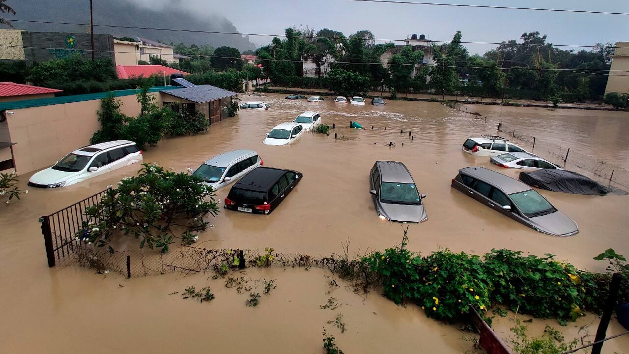 Submerged cars are seen at a flooded hotel resort as extreme rainfall caused the Kosi River to overflow at the Jim Corbett National Park in Uttarakhand, India, October 19. More than 20 people have died and many are missing in floods triggered by heavy rains in the northern Indian state of Uttarakhand, officials said Tuesday. (Image: AP)