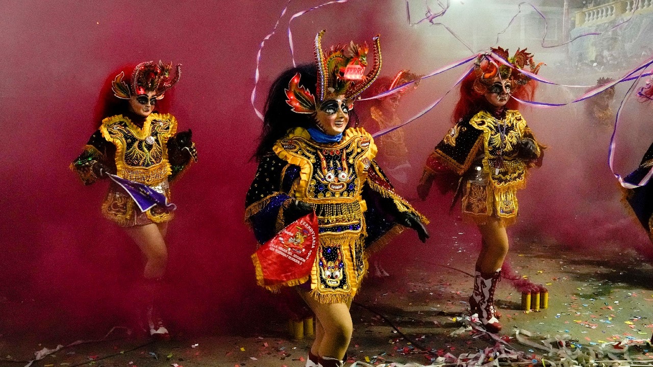 And in Oruro, Bolivia, the Diablada de Oruro dance -- a fixture of the Andes for hundreds of years -- is back after a one-year hiatus. Its absence was keenly felt. Dancer Andrea Hinojosa recalls how hard it was to sit at home last year and watch tapes of previous carnivals; he was elated to don the spectacular devil’s costume once more. "Today,” he says, “the joy is back, we are dancing La Diablada again.” (Image: AP) And in Oruro, Bolivia, the Diablada de Oruro dance -- a fixture of the Andes for hundreds of years -- is back after a one-year hiatus. Its absence was keenly felt. Dancer Andrea Hinojosa recalls how hard it was to sit at home last year and watch tapes of previous carnivals; he was elated to don the spectacular devil’s costume once more. "Today,” he says, “the joy is back, we are dancing La Diablada again.” (Image: AP)
