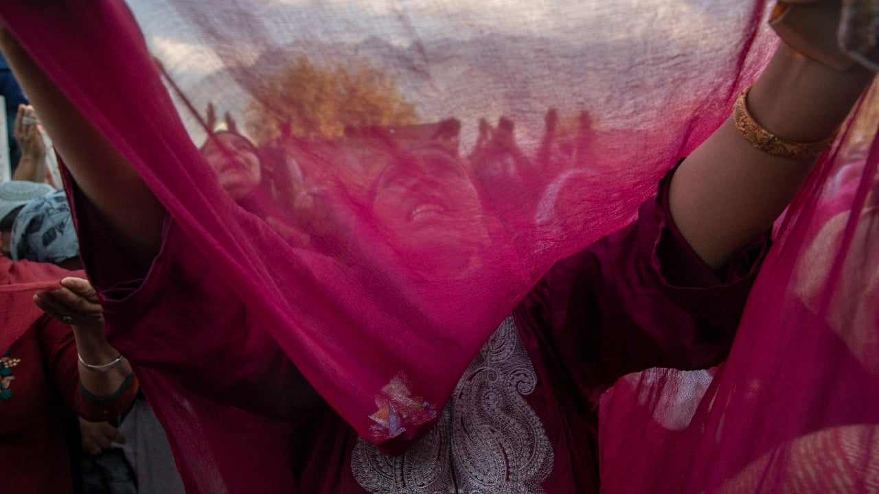 Kashmiri Muslims raise their hands in prayer as a head priest displays a relic, believed to be a hair from the beard of the Prophet Mohammad, at the Hazratbal shrine on Eid-e-Milad, the birth anniversary of the prophet, in Srinagar, Kashmir, October 19. (Image: AP)