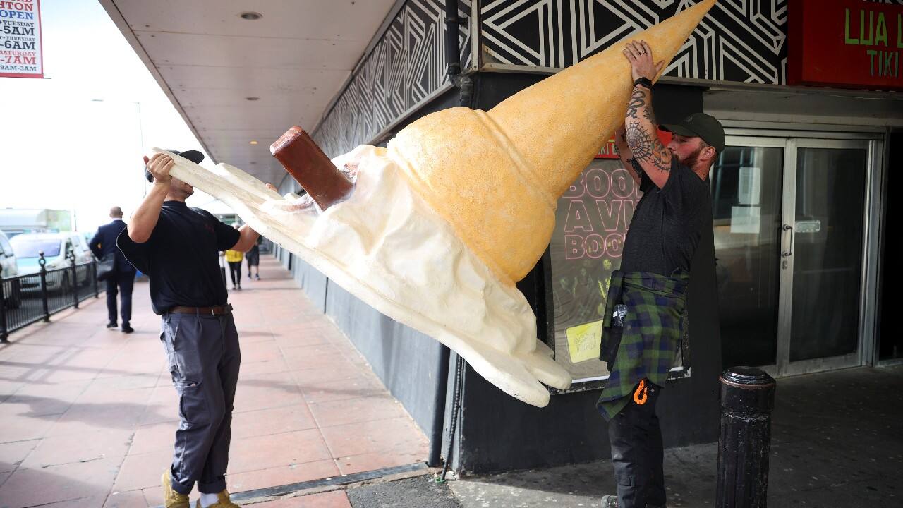 Visual artists carry an oversized sculpture of ice cream outside the annual Labour Party conference, in Brighton, Britain, September 28. (Image: Reuters)