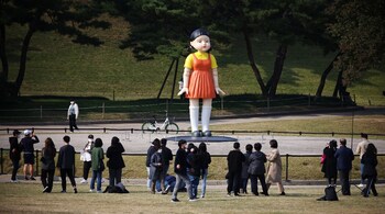 An imitation of a giant doll featuring in South Korean survival drama 'Squid Game' was launched this week at a Seoul park, giving fans and curious onlookers a chance to experience a bit of what it feels like being on Netflix’s mega hit show. (Image: Reuters)