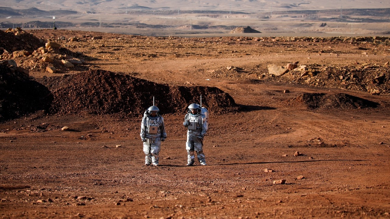 From the door of the expedition base, a few small steps to the left an autonomous rover passes by. A few giant leaps to the right is an array of solar panels. The landscape is rocky, hilly, tinged with red. Purposefully it resembles Mars. (Image: Reuters)