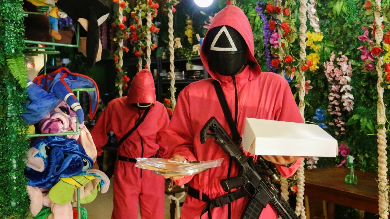 Patrons play Squid Game at an Indonesian cafe