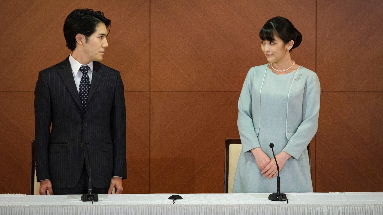 Japan's former Princess Mako, right, the elder daughter of Crown Prince Akishino and Crown Princess Kiko, and her husband Kei Komuro, look at each other during a press conference to announce their marriage at a hotel in Tokyo, Japan, October 26. Former Princess Mako married the commoner and lost her royal status Tuesday in a union that has split public opinion after a three-year delay caused by a financial dispute involving her new mother-in-law. (Image: AP)