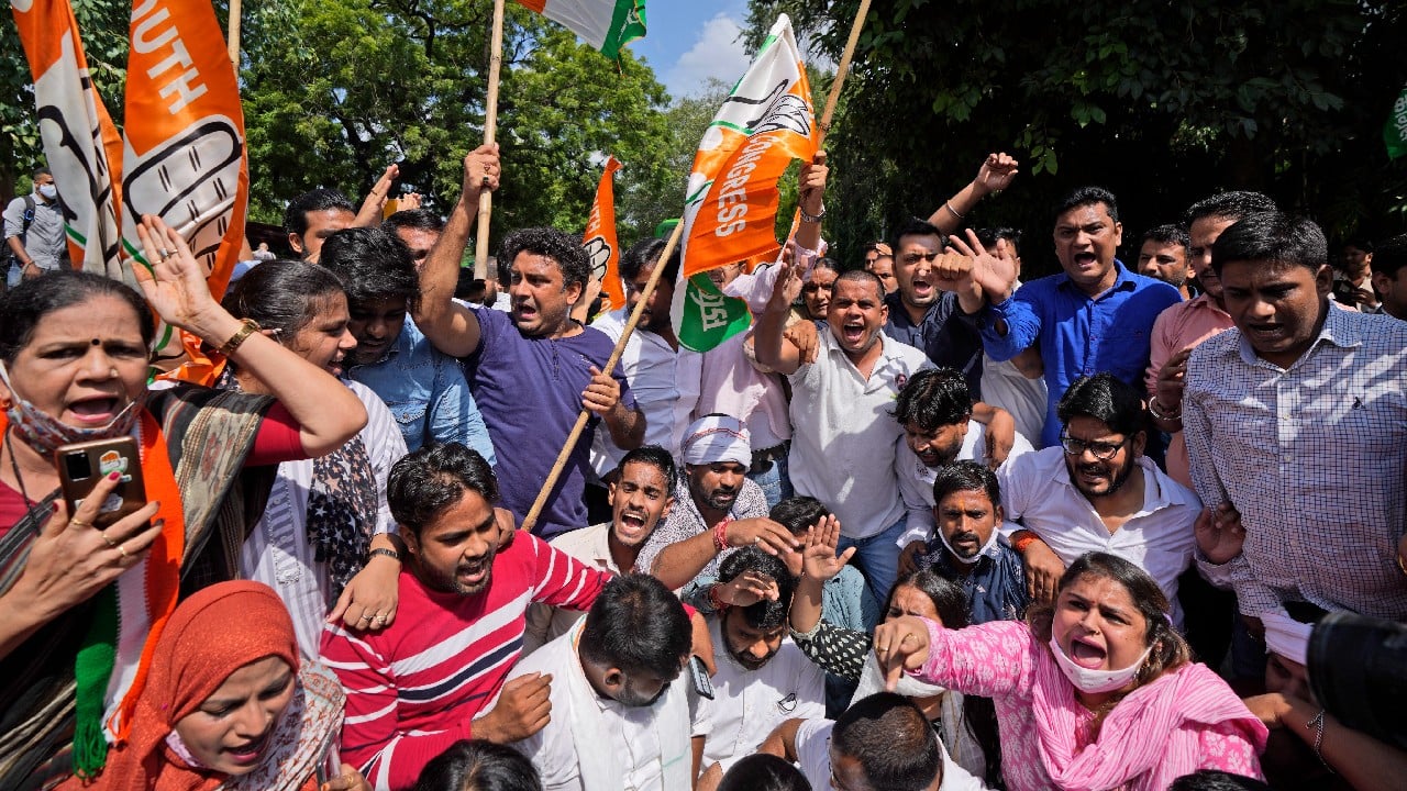 Activists of Congress party's youth wing protesting against Sunday's killing of four farmers in Uttar Pradesh state after being run over by a car owned by India's junior home minister shout slogans in New Delhi, October 4. (Image: AP)
