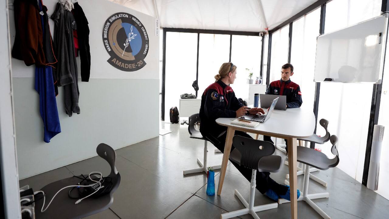 Their AMADEE-20 habitat is tucked beneath a rocky outcrop. Inside they sleep, eat and conduct experiments. Outside they wear mock space suits fitted with cameras, microphones and self-contained breathing systems. (Image: Reuters)
