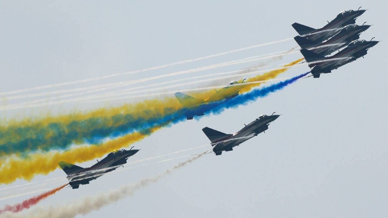 Members of the &quot;August 1st&quot; Aerobatic Team of the Chinese People's Liberation Army (PLA) Air Force perform during the 13th China International Aviation and Aerospace Exhibition on September 29, 2021, in Zhuhai in southern China's Guangdong province. (Image: AP)