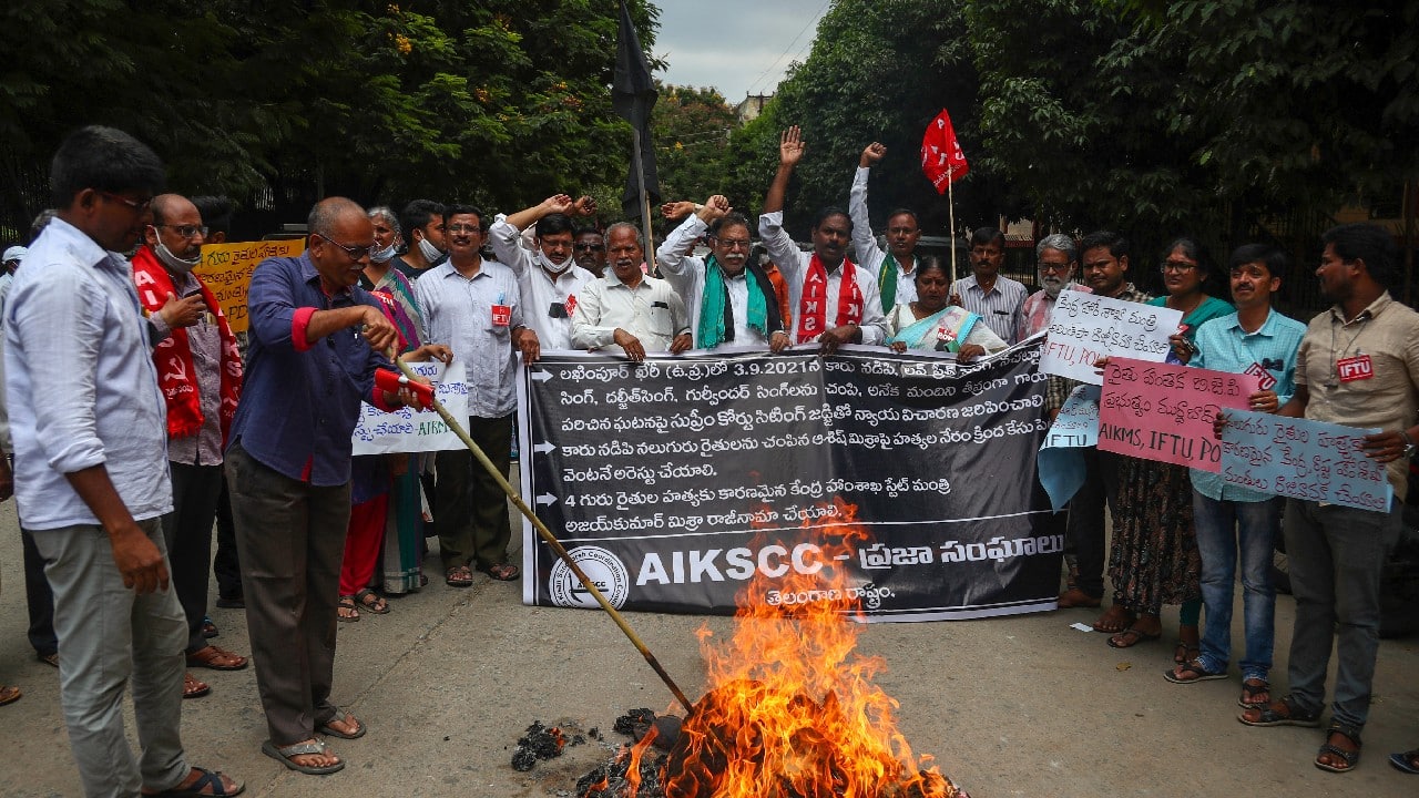 Indian farmers protesting against Sunday’s killing of four farmers in Uttar Pradesh state after being run over by a car owned by India's junior Home Minister Ajay Mishra burn an effigy of the federal government in Hyderabad, October 4. (Image: AP)