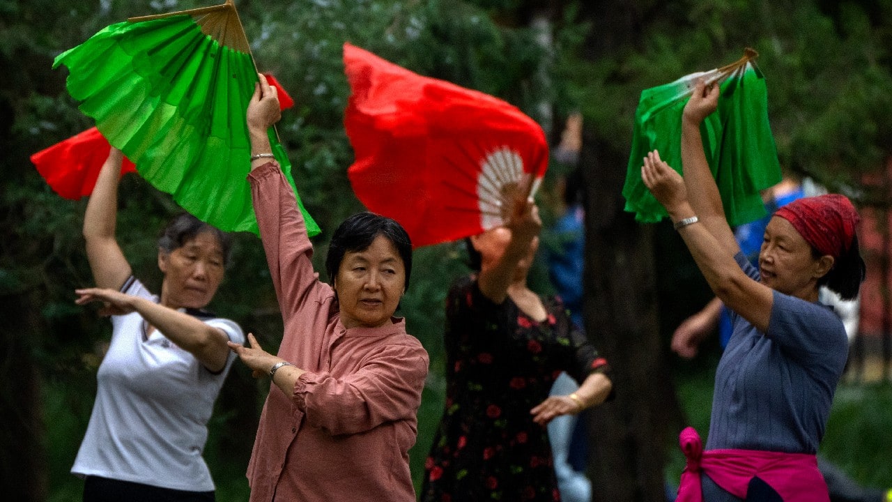 In a Beijing, a park is alive with plaza dancing -- an activity popular with middle-aged and older women, curtailed at the pandemic’s height. “As long as I can move, I will keep dancing,” says Li Fei, a lead dancer. (Image: AP) In a Beijing, a park is alive with plaza dancing -- an activity popular with middle-aged and older women, curtailed at the pandemic’s height. “As long as I can move, I will keep dancing,” says Li Fei, a lead dancer. (Image: AP)