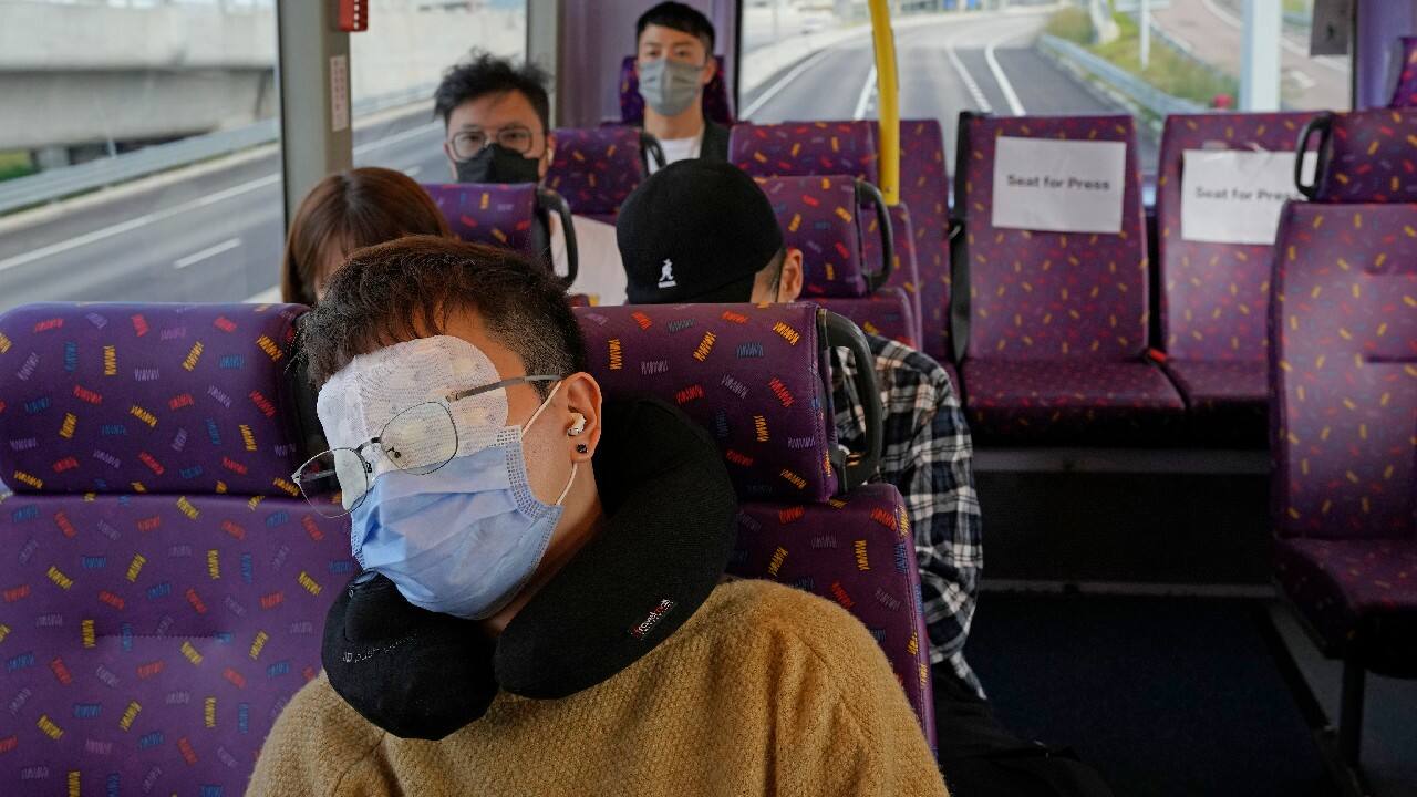 A passenger, front, sleeps on the upper deck of a double-decker bus in Hong Kong, October 16. Travel-starved, sleep-deprived residents might find a new Hong Kong bus tour to be a snooze. The 47-mile, five-hour ride on a double-decker bus around the territory is meant to appeal to people who are easily lulled asleep by long rides. (Image: AP)