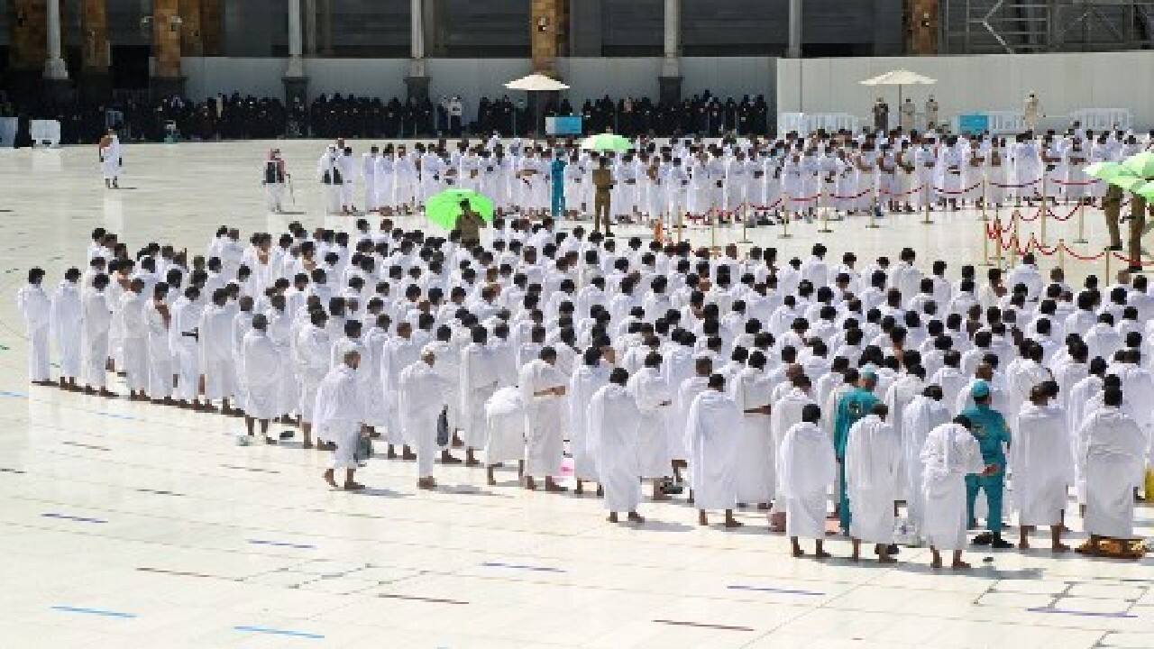 Pictures and footage on Sunday morning showed people praying side by side, making straight rows of worshippers that are formations revered in performing Muslim prayers, for the first time since the Covid-19 pandemic took hold last year. (Image: AFP)