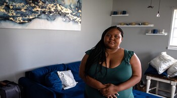 Tara Jones, an Amazon warehouse worker, at her home in Moore, Okla., on July 25, 2021. Jones sent an email directly to Jeff Bezos after an unresolved mistake in her paycheck. A knot of problems with Amazon’s system for handling paid and unpaid leaves has led to devastating consequences for workers. (Joseph Rushmore/The New York Times)