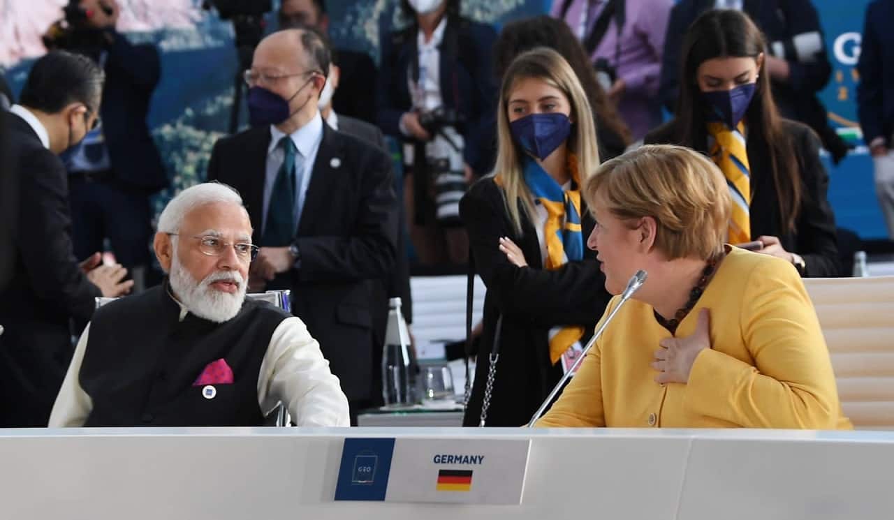 Modi is seen sharing the table with German Chancellor Angela Merkel. This will be Merkel's final visit to G20 as the head of the German state, as she would be retiring from politics by end of the year.