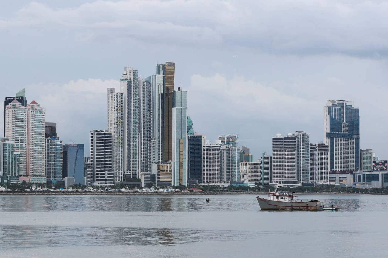 A fishing boat is pictured as the skyline of the city is seen in the background, in Panama City, Panama October 4, 2021. REUTERS/Erick Marciscano - RC233Q9FULRJ