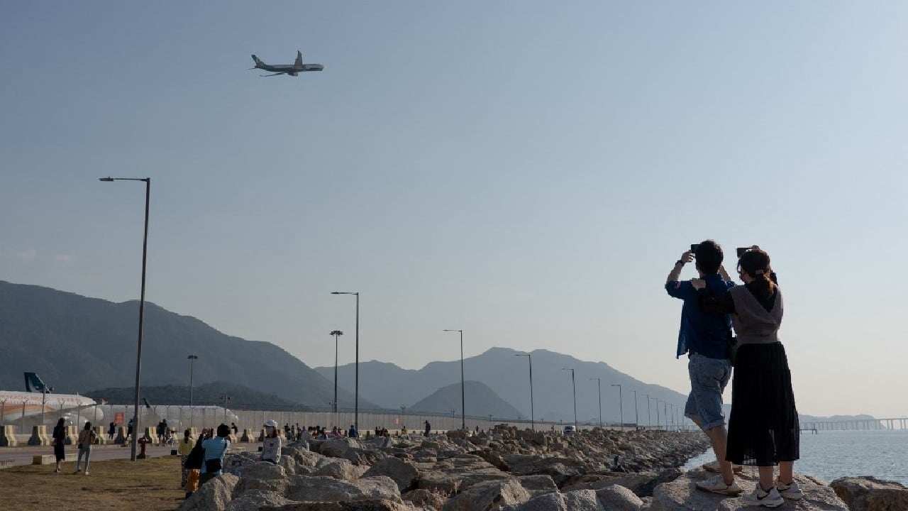 Hong Kong has maintained some of the world's harshest quarantine measures and travel restrictions during the pandemic. The strategy has kept infections low but ensured a business hub that dubs itself "Asia's World City" has been cut off isolated for the past 20 months. "In the past, I would go to the airport (for travelling) each month," a male passenger, who declined to give his name, told AFP. "Aside from sleeping, this tour also gives us a sense of travelling." (Image: AFP) Hong Kong has maintained some of the world's harshest quarantine measures and travel restrictions during the pandemic. The strategy has kept infections low but ensured a business hub that dubs itself "Asia's World City" has been cut off isolated for the past 20 months. "In the past, I would go to the airport (for travelling) each month," a male passenger, who declined to give his name, told AFP. "Aside from sleeping, this tour also gives us a sense of travelling." (Image: AFP)