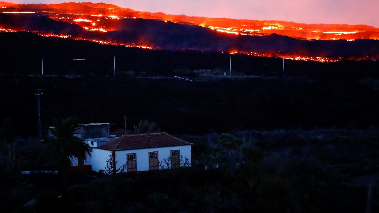 The Cumbre Vieja volcano continues to expel lava as seen from the Tajuya viewpoint on the Canary Island of La Palma, Spain. (Image: Reuters) The Cumbre Vieja volcano continues to expel lava as seen from the Tajuya viewpoint on the Canary Island of La Palma, Spain. (Image: Reuters)