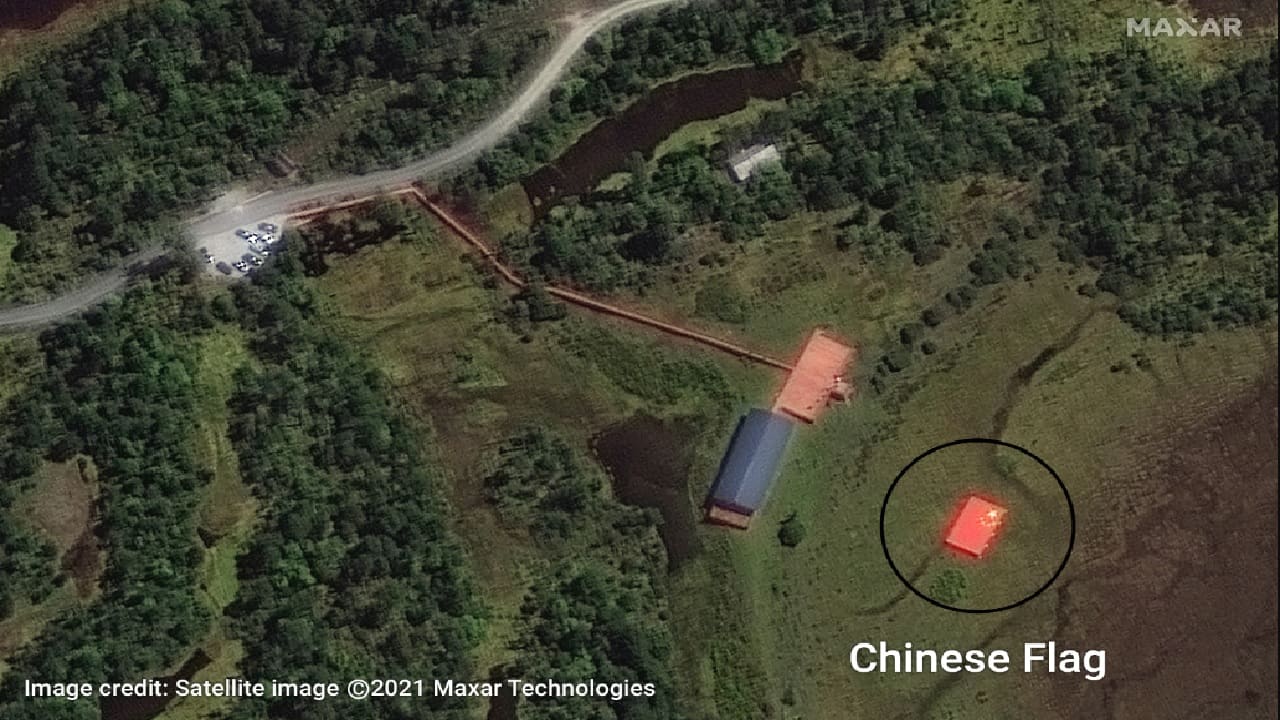 Chinese national flag painted atop a structure in the Chinese enclave. (PC-Satellite Image @2021 Maxar Technologies)
