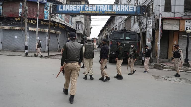 Police personnel at Lambert market in Srinagar. (Photo by Irfan Amin Malik)