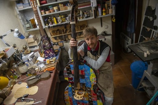 Spanish luthier Fernando Solar poses in his workshop in Madrid. (Image credit: AFP