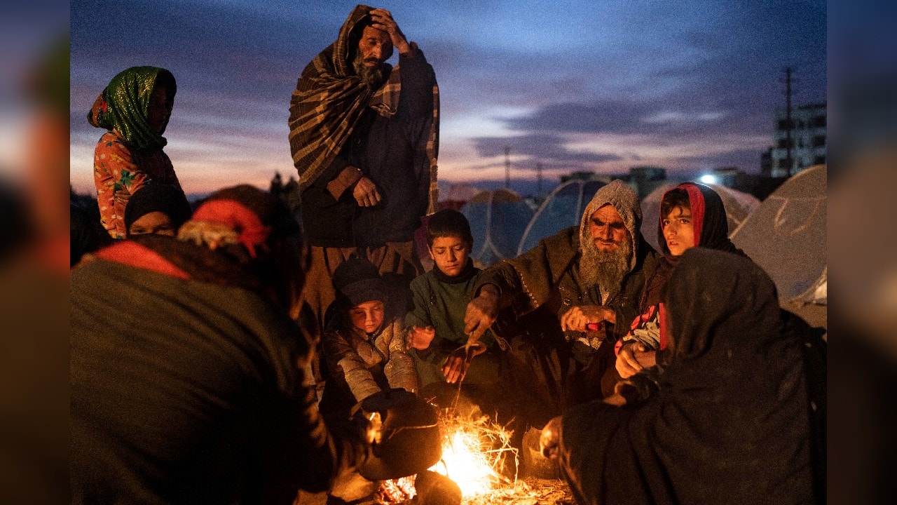 For millions living in camps for the displaced or sitting outside government ministries seeking help, the only source of warmth is to huddle around open wood-burning fires. (Image: AP)