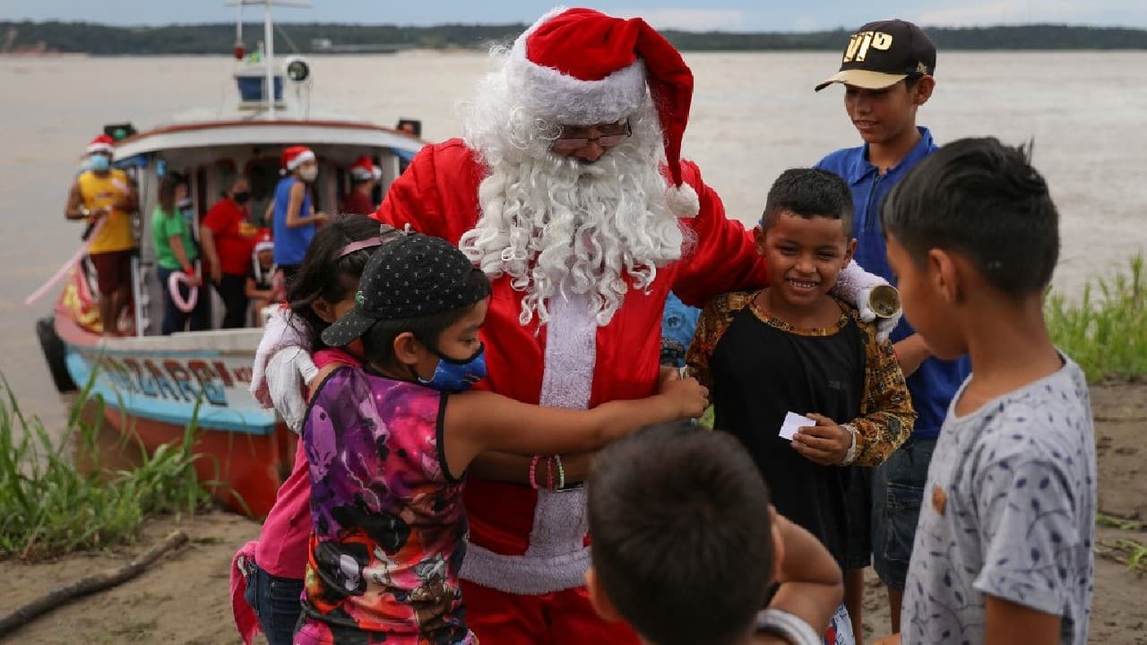 His red-and-white costume stands in sharp contrast to the emerald green tones of the world's largest tropical forest and the muddy brown waters of the Solimoes River, which feeds into the mighty Amazon. (Image: AFP)