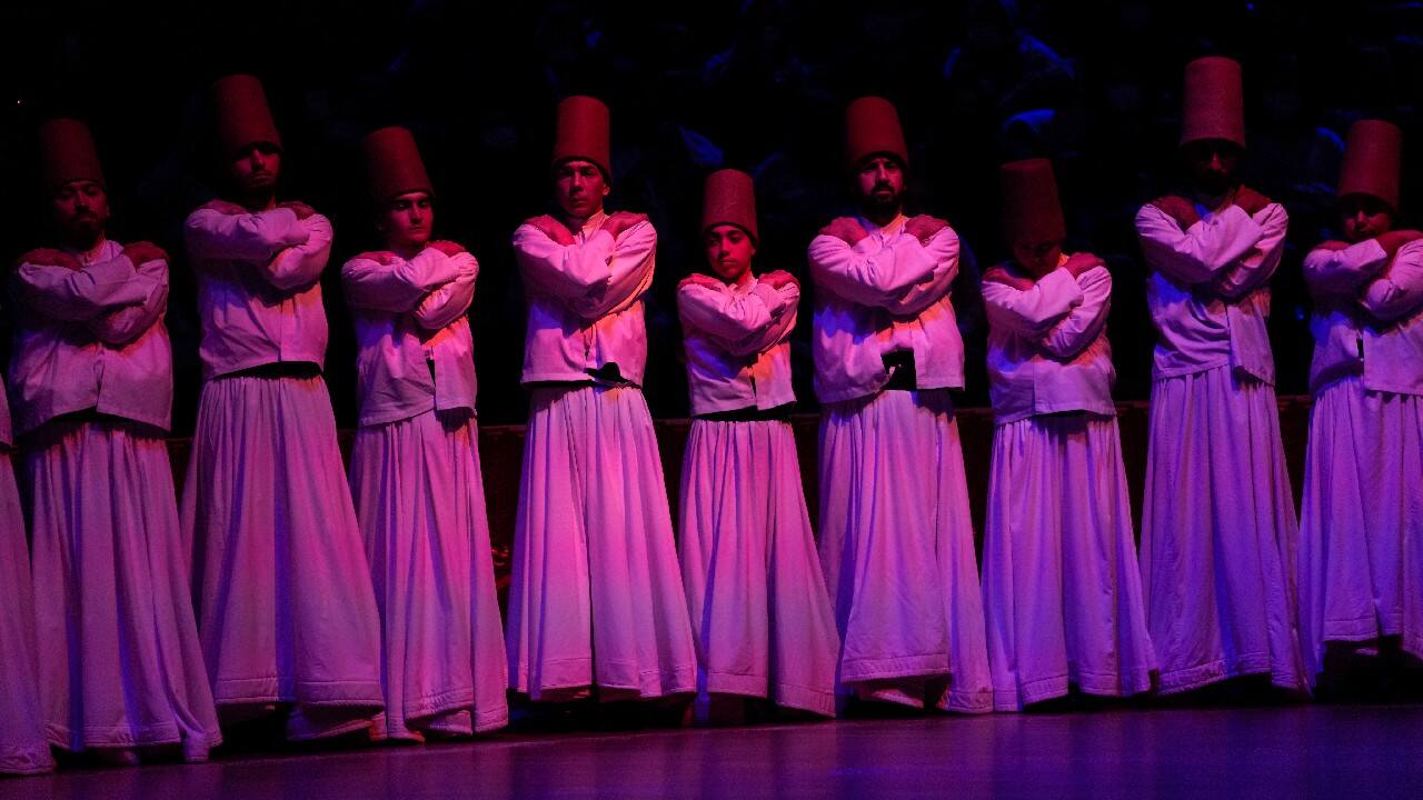 The rite begins with a recital of prayers and verses from the Quran. The dervishes, dressed in long white robes symbolizing shrouds, black cloaks symbolizing tombs and long headgear symbolizing tombstones, then rise from the ground to salute each other. (Image: AP)