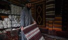Afghan families go back to making carpets as economy unravels