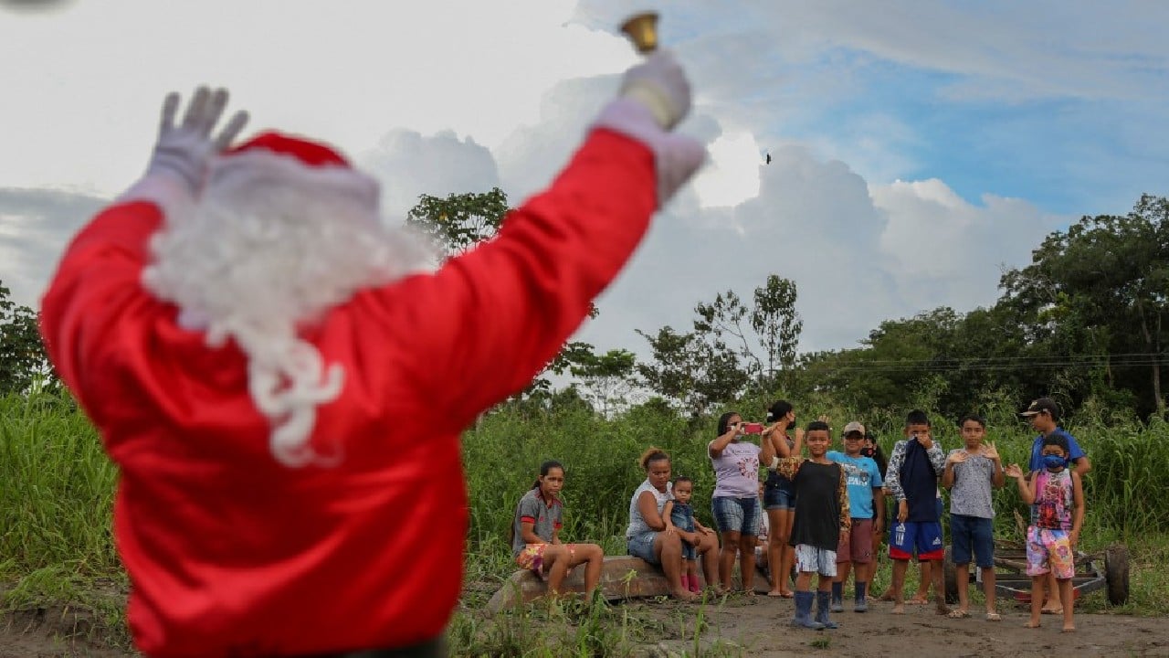 So even if there was no white Christmas here -- the late afternoon instead saw a torrential downpour -- Santa and his &quot;elves&quot; are undaunted. They organize games, apply cheery makeup to eager young faces and, yes, spread a good deal of joy. (Image: AFP)