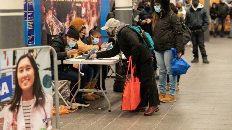 People sign up for a COVID-19 test at a new popup testing site in Times Square subway station in Manhattan on Dec 27. (Image: Reuters) , Disruption, dismay, dissent: Americans grapple with Omicronâs rise, The World Live Breaking News Coverage & Updates IN ENGLISH