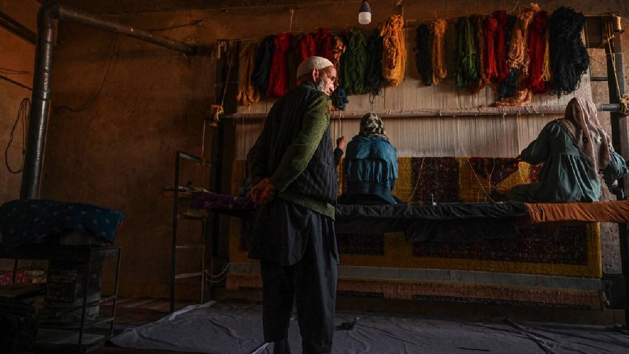 They work long hours each day, keeping a brave face even though there is no guarantee they will have anyone to sell their carpets to. &quot;We have no other option&quot; to keep the family alive, said Ghulam Sakhi, the 70-year-old family patriarch. (Image: AFP)