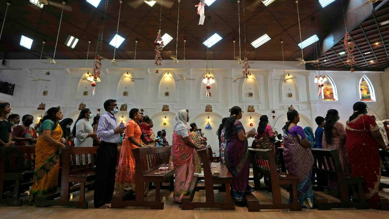Sri Lankan Christians, mostly wearing face masks as a precaution against the COVID-19, attend a Christmas mass at a church in Colombo, Sri Lanka, December 25. (Image: AP)