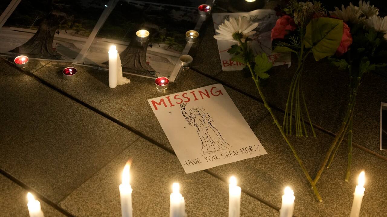 University students light candles at the site after the &quot;Goddess of Democracy&quot; statue, a memorial for those killed in the 1989 Tiananmen crackdown, was removed from the Chinese University of Hong Kong, December 24. The university early Friday morning took down the statue that was based on a figure created by art students and brought to the square shortly before the crackdown in which hundreds of people were killed. (Image: AP)