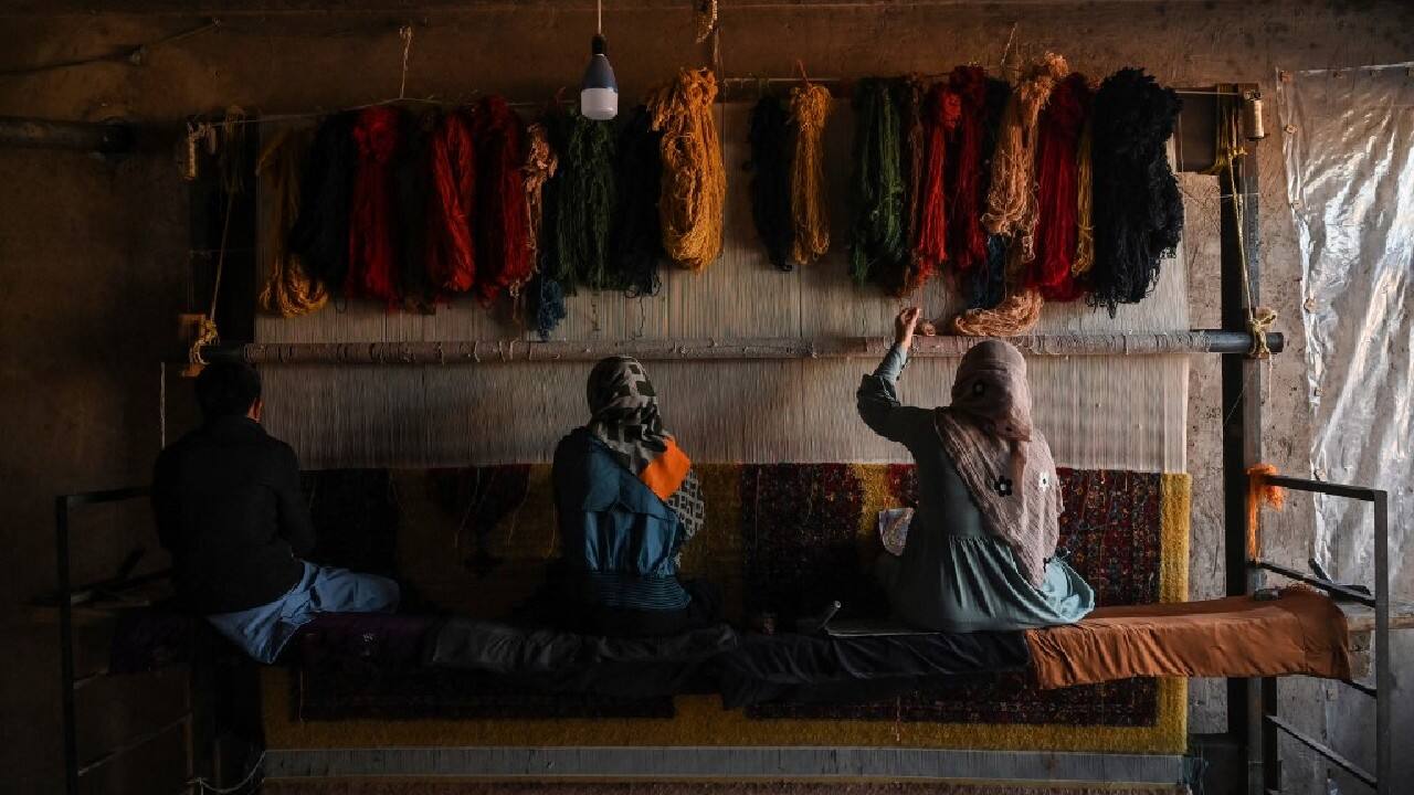 In Herat, near the Iranian border, Haji Abdul Qader already employs around 150 families for his carpet-making business. But every day, two or three more people contact him, desperate for work. Even those with no experience get in touch. (Image: AFP)
