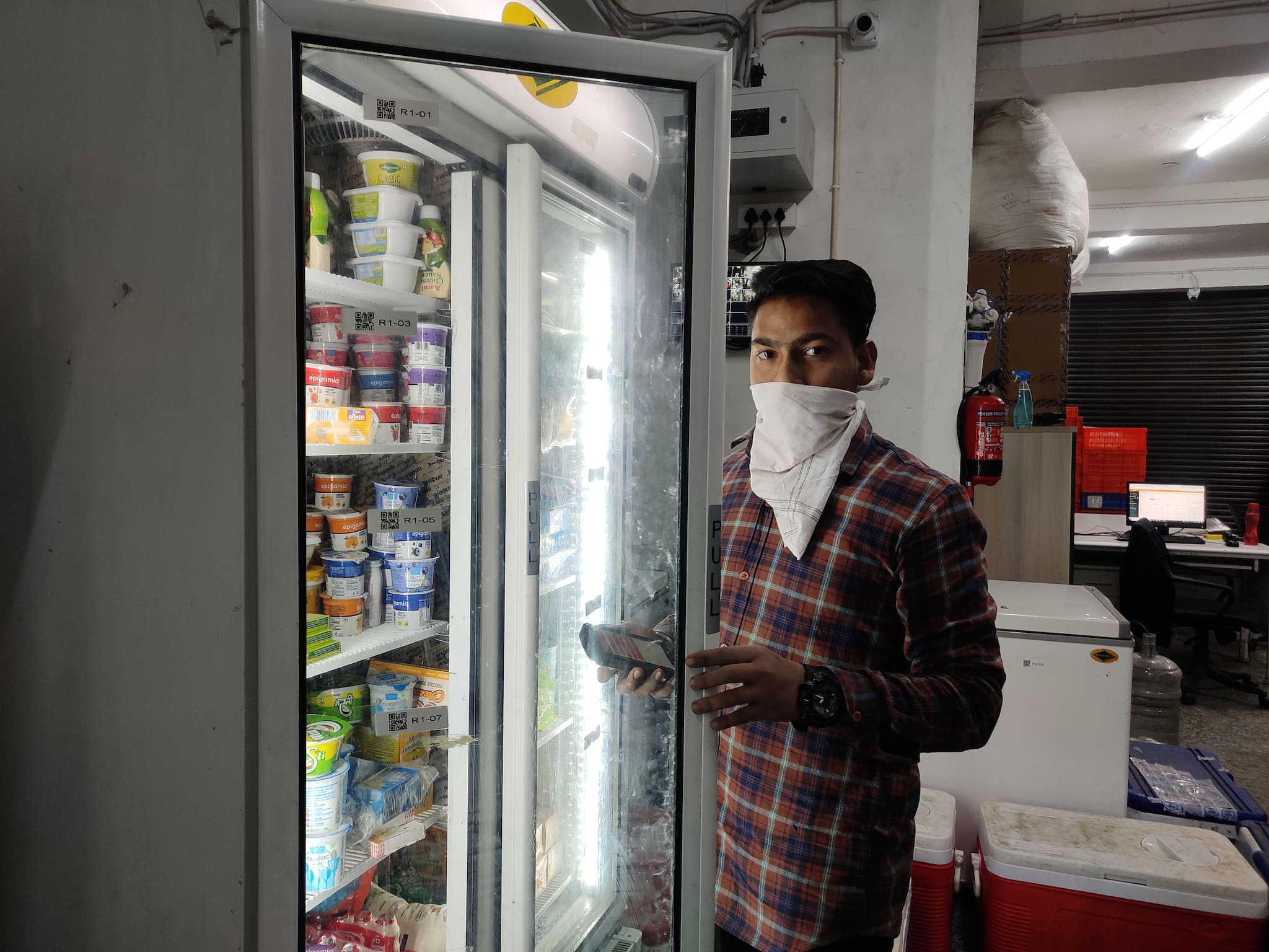 Vishu scanning items from the cold storage section.