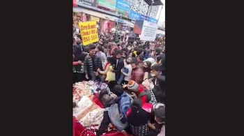 The viral video from Delhi's Sarojini Nagar shows shoppers falling on each other and jostling for space. (Image credit: Screengrab from video tweeted by @sarikatalwar)