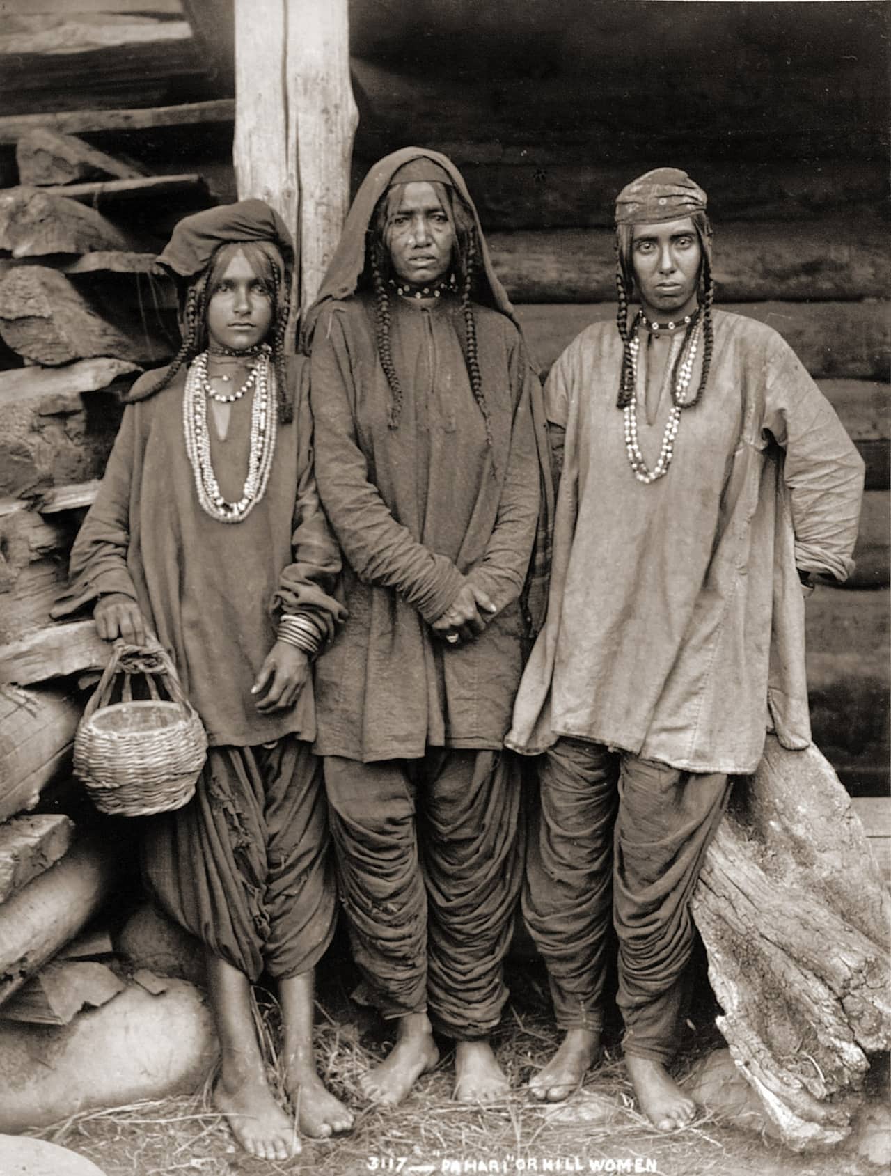 Public domain photo "Pahari" or hill women. Full-length portrait of three Paharia women in the modern-day state of Jammu and Kashmir, taken by an unknown photographer in the 1890s. The text accompanying a similar image of Paharis in John Forbes Watson's 'The People of India' (1869) states,"The Paharis of Bhaugulpoor are a race, inhabiting the hilly and jungly country (the name signifies hillman) of that large territory...They are hunters rather than cultivators. They are largely employed as coolies (or luggage bearers) by persons travelling between the hill and plain country." Oriental and India Office Collection, British Library. Downloaded by me (Fowler&fowler«Talk» 13:58, 1 January 2007 (UTC)) from the British Library web site and then cropped for Wikipedia. Fowler&fowler«Talk» 13:58, 1 January 2007 (UTC)