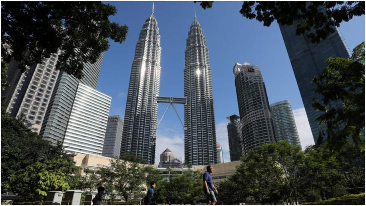 Foreign residents in Kuala Lumpur are satisfied with the affordable cost of living and the ability to manage their personal finances. According to the survey, 85% are happy with life in general, 65% say making new friends is easy, and 71% are happy with their job. (Image credit: Reuters)