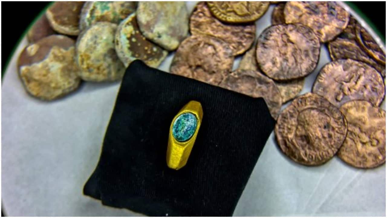 A gold ring bearing the symbol of the Good Shepherd, one of the earliest expressions to refer to Jesus, is displayed at the Israeli Antiquities Authority lab in Jerusalem on December 22. (Image credit: AFP)