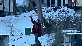 Canada: The woman stood on top of her yellow car in Ottawa’s Rideau River. (Image credit: Photo tweeted by @MammaMitch)