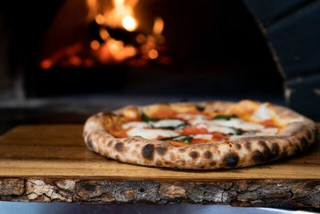 Neapolitan pizzas have thin, crispy centers and puffy, spotted edges.