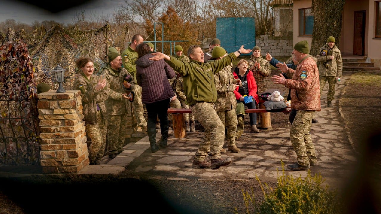 Soldiers on the tense front line take pensive smoke breaks, steal a moment to dance playfully, or take up fighting positions, their eyes haunted. (Image: AP)